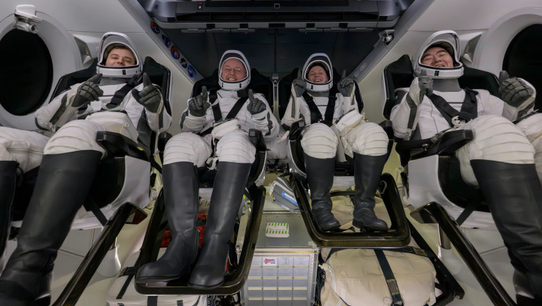 Roscosmos cosmonaut Oleg Platonov, left, NASA astronauts Mike Fincke, Zena Cardman, and JAXA (Japan Aerospace Exploration Agency) astronaut Kimiya Yui are seen inside the SpaceX Dragon Endeavour spacecraft