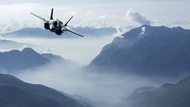 F-35 Army Fighter jet flying over mountains