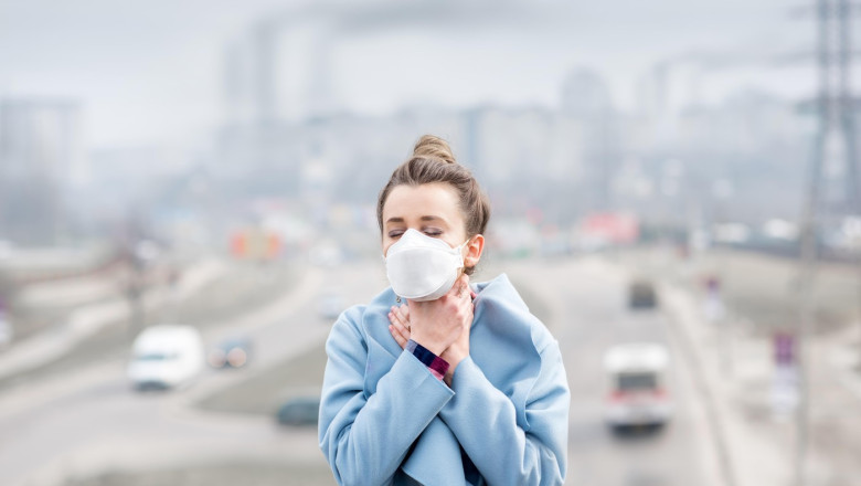 Woman with mask in the city