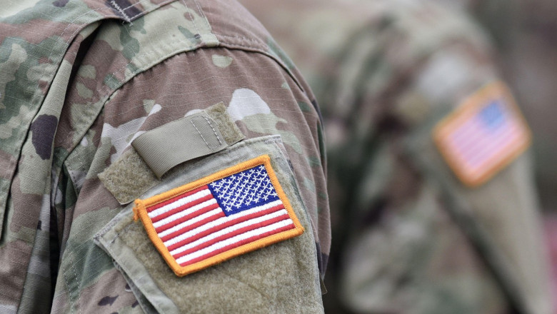 US soldiers. US army. USA patch flag on the US military uniform. United States Armed Forces. Veterans Day.