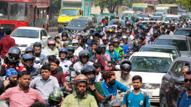 People wait in a long queue as they rush to petrol pumps to refuel amid fears of a fuel shortage in Dhaka, Bangladesh, on Saturday, March 7, 2026. Long lines of motorcycles and private cars formed across the capital as motorists hurried to fill their tank