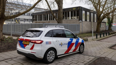 police car parked outside a Jewish school, in Amsterdam, where an explosion was reported overnight