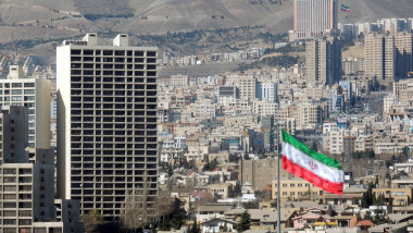 Tehran urban skyline and Iran flag