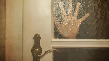 Silhouette of Hand Coming opening the door slowly