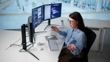 Unhappy Woman Programmer Frustrated With Broken AI Chatbot Workflow System.