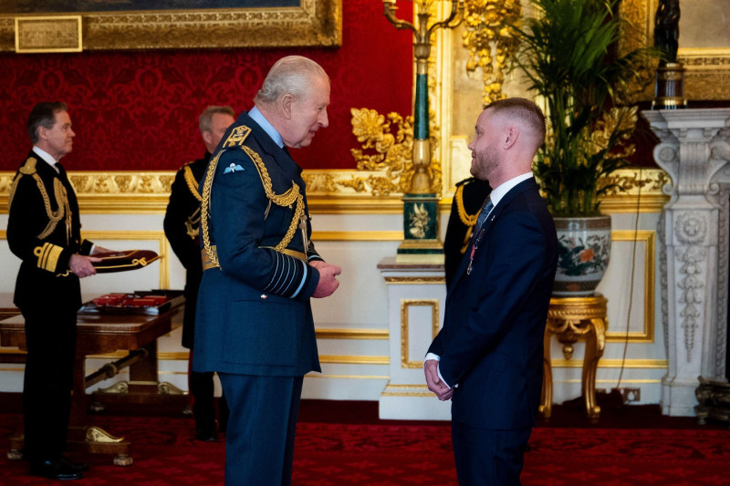 Mr. Nathan Newby is decorated with the George Medal by King Charles III, during an investiture ceremony at St James's Palace, London. The award recognises Mr Newby's bravery for intervening in a potential terror incident in Leeds. Picture date: Wednesday