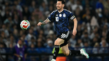 Lionel Messi runs for the ball during a friendly football match between Argentina and Mauritania