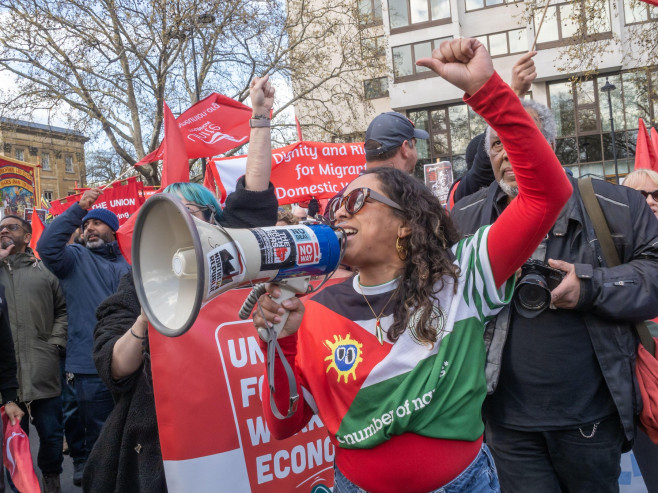 London, UK. 28 March 2026. People shout defiantly at a handful of counter-protesters withj Izraeli flags and Pahlavi Iranian flags. More than a hundred thousand came to march though London against the growing division and hatred being spread by the far ri