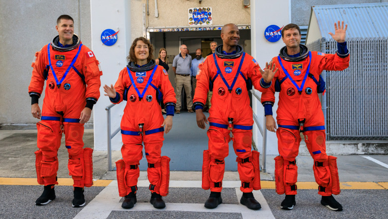 Artemis II crew members (from left) CSA (Canadian Space Agency) astronaut Jeremy Hansen, and NASA astronauts Christina Koch, Victor Glover, and Reid Wiseman in red suits