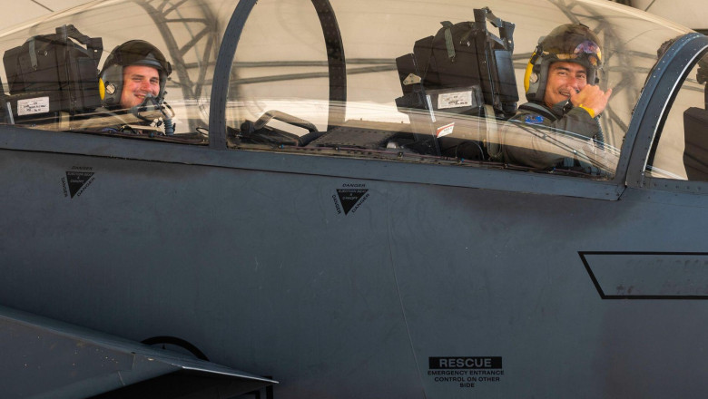 Aircrew members from the 336th Fighter Squadron park under a canopy after flying in an F-15E Strike Eagle at Seymour Johnson Air Force Base, North Carolina, July 15, 2021. The aircraft uses two crew members, a pilot and a weapons system officer.