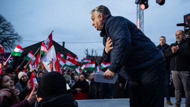 Hungarian PM VIKTOR ORBAN takes a bow as his supporters cheer for him ar poitical rally