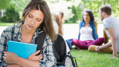 Lonely student feeling excluded on campus at the university