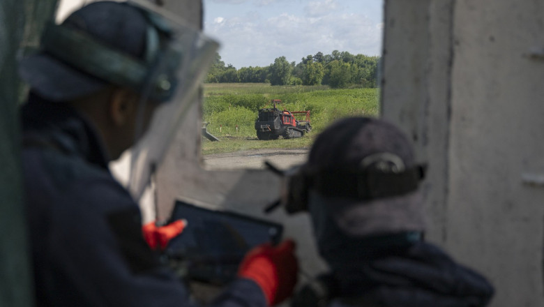 HALO Trust deminers clear explosives near Budy village in Kharkiv