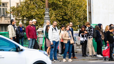 People crossing the street. Bucharest, Romania, 2023