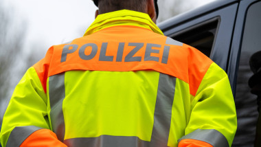 Ottobeuren, Bavaria, Germany April 15, 2026: A police officer wearing a high-visibility vest during a traffic stop in a