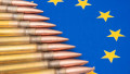 The ammunition lies against the background of the EU flag, emphasising the theme of military supplies and NATO