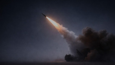Surface-to-air missile launching at night from a desert location, illuminating fog, smoke, and dust