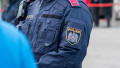 The police uniform with the eagle patch represents the modern uniform of the Austrian police. Austria, Vienna, October 26, 2025