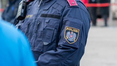 The police uniform with the eagle patch represents the modern uniform of the Austrian police. Austria, Vienna, October 26, 2025