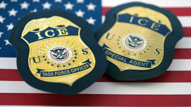 KYIV, UKRAINE - MARCH 13, 2026 Department of Homeland Security USCIS Immigration and Customs Enforcement ICE badge on United States flag