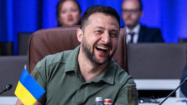 Ukrainian President Volodymyr Zelensky laughs