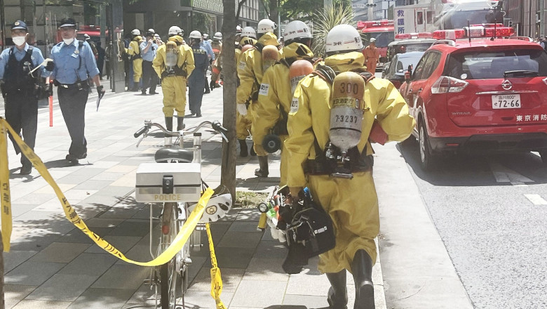 Firefighters work at the scene of an odor incident near Ginza Six in Tokyo's Chuo Ward