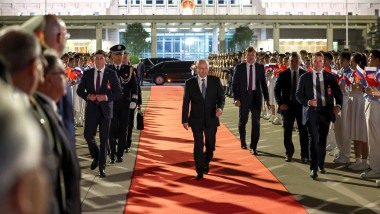 Vladimir Putin walks at Beijing Capital Airport as he departs Beijing on May 20, 2026