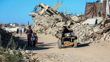 Palestinians living in tents and among the rubble of destroyed homes in the area between the yellow line and the orange line