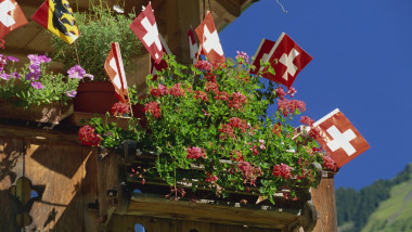 Display of flags to mark Swiss National Day, Lauterbrunnen, Bern, Swizerland, Europe