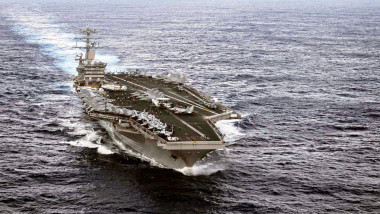 Aerial view of the US Navy aircraft carrier USS Nimitz during an airshow to mark the transition to the 3rd Fleet December 8, 2013 off the coast of Hawaii.
