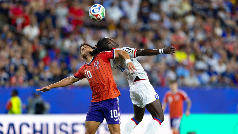 Scotland forward Che Adams (10) and Haiti defender Ricardo Ade (4) compete for a ball in a FIFA World Cup 2026