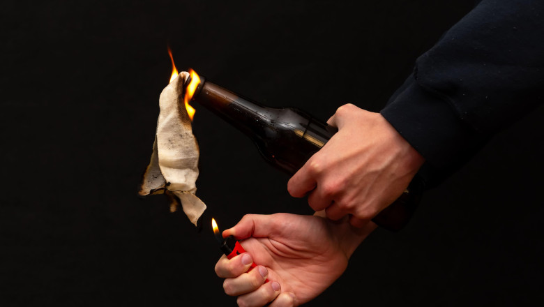 An image of street warfare and anarchy using a flammable mixture in a bottle