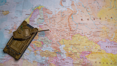 Toy tank model on map of Europe Union.