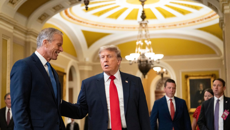 United States President Donald J Trump walks through in the Ohio Clock Corridor outside the US Senate Chamber in the US Capitol in Washington, DC, USA, with US Senate Majority Leader John Thune (Republican of South Dakota) en route to the US Senate Republ