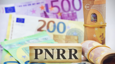 Banknotes with letters Pnrr (national recovery and resilience plan)