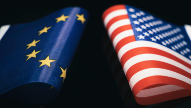 flags of USA and European Union on a black background. The concept of interaction or counteraction between the two countries. International relations.