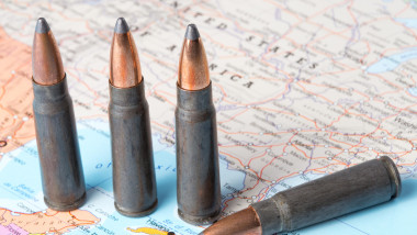 Four bullets on the geographical map of United States of America. Conceptual image for war, conflict, violence.