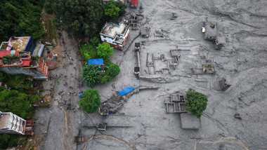 Nepal-China flash flood death toll rises, hundreds remain missing