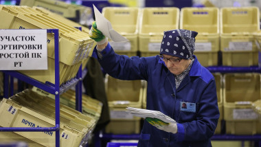 woman works in the sorting office of Russian Post's logistics centre