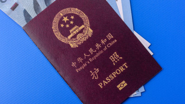 China, Chinese passport with money and flight tickets. Chinese passport with tickets as a background for your design