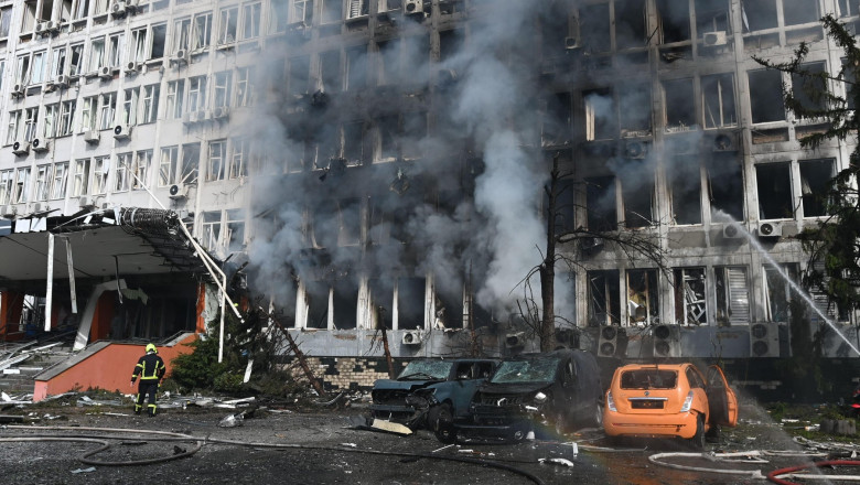 Smoke rises over an office building following Russian drone strikes during Russia's attack on Ukraine. Russia massively shells Kyiv with missiles and drones. At least eight people were injured, and one died in the hospital. Explosions echoing across downt