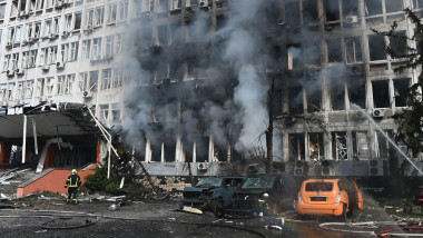 Smoke rises over an office building following Russian drone strikes during Russia's attack on Ukraine. Russia massively shells Kyiv with missiles and drones. At least eight people were injured, and one died in the hospital. Explosions echoing across downt