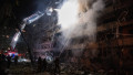 2 dead and 21 injured as Russian missile hits Kyiv residential building