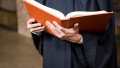 Lawyer holding a law book