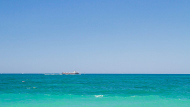 A ship on the horizon of the black sea