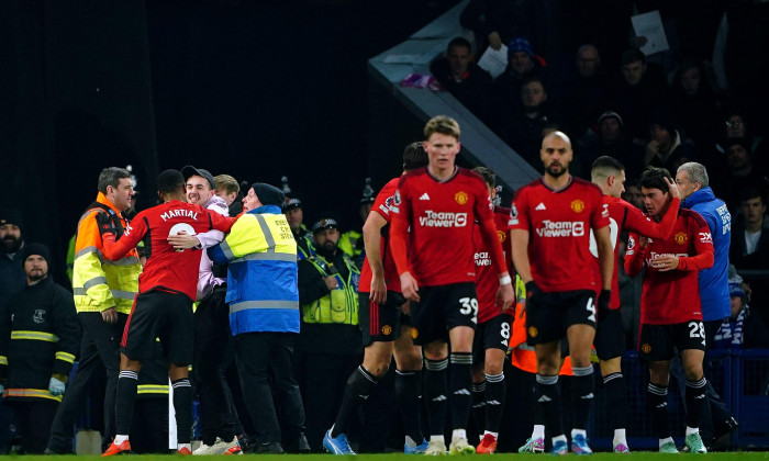 Manchester United's Anthony Martial (left) celebrates with a fan after scoring their side's third goal of the game during the Premier League match at Goodison Park, Liverpool. Picture date: Sunday November 26, 2023.