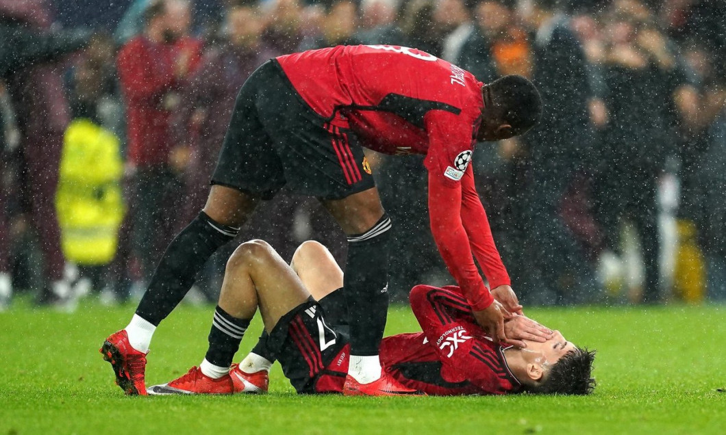 Manchester United's Alejandro Garnacho (right) is consoled by team-mate Anthony Martial after the final whistle in the UEFA Champions League Group A match at Old Trafford, Manchester. Picture date: Tuesday October 3, 2023.