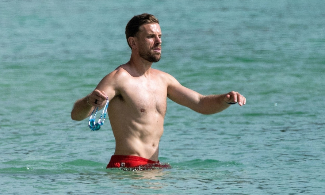 Liverpool FC and England footballer Jordan Henderson pictured relaxing on the beach during holiday in Barbados.
