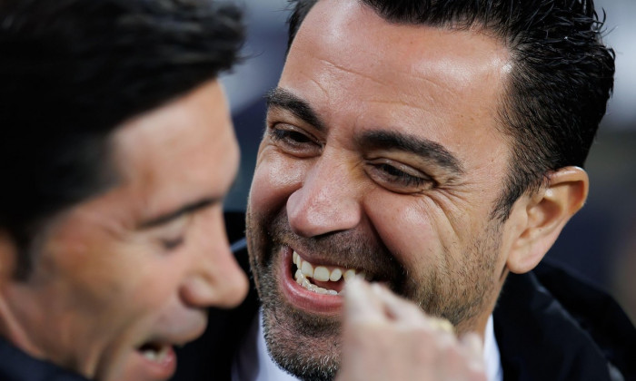 Barcelona, Spain. 27th Feb, 2022. Xavi Hernandez happy talks with Marcelino at the La Liga match between FC Barcelona and Athletic Club de Bilbao at the Camp Nou Stadium in Barcelona, Spain. Credit: Christian Bertrand/Alamy Live News