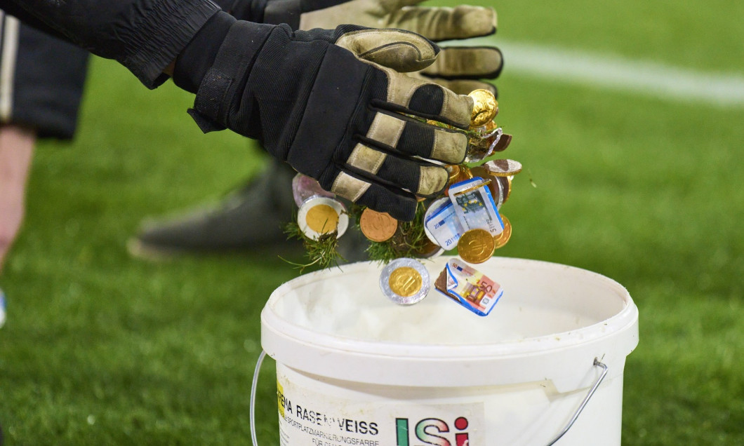 Fans demonstrate with chocolate money against DFL investors in the match FC BAYERN MUENCHEN - WERDER BREMEN on Jan 21, 2